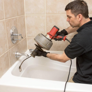 Cleaning out the drain on a bathtub involves removing hair, debris, and buildup to ensure proper water drainage and prevent clogs.